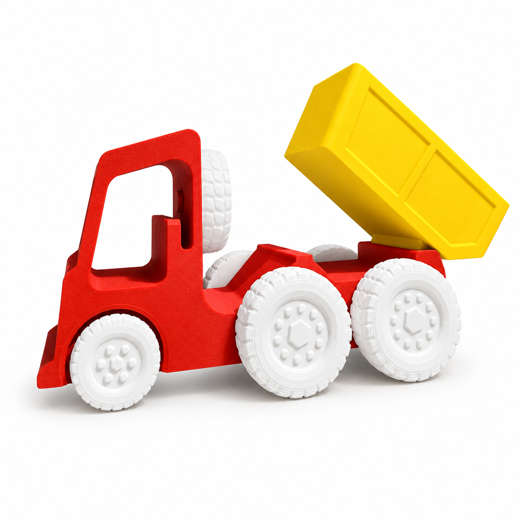 Red and yellow toy dump truck with bed tipped up on white background