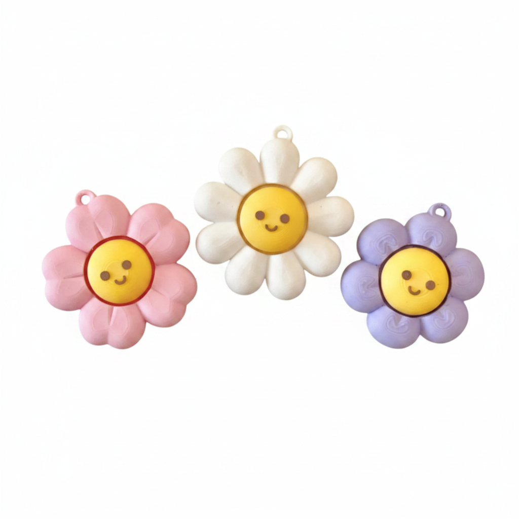Sunflower Clicker fidget toy in pink, white and purple, white background
